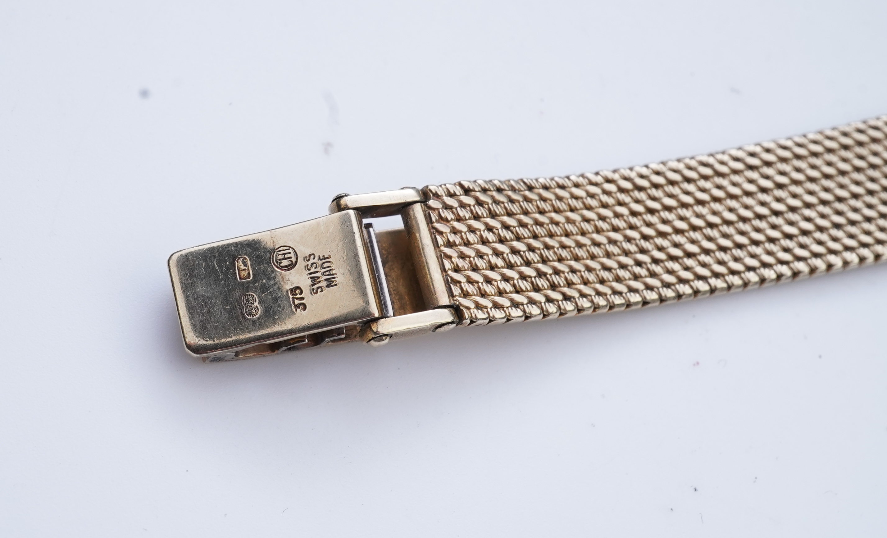 Longines, a gold watch